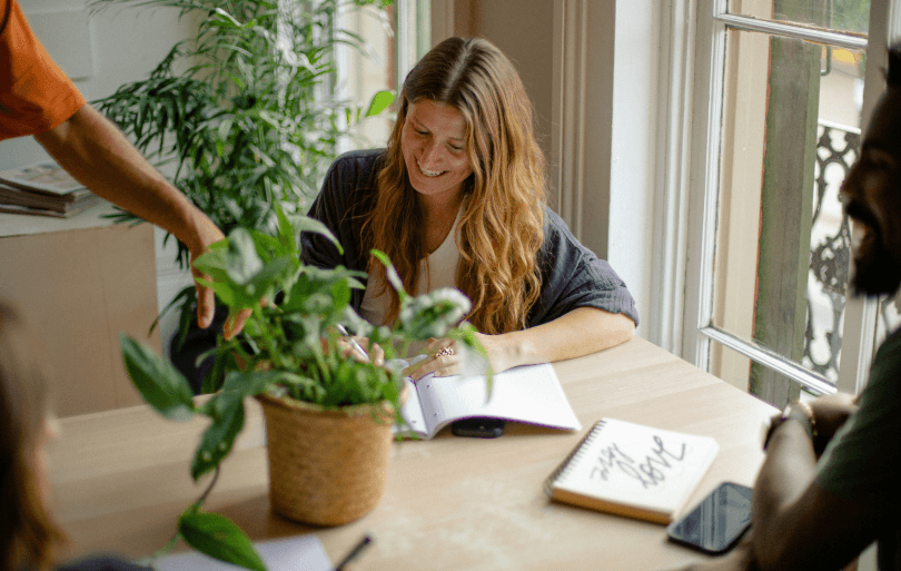 People in a meeting discussing application materials